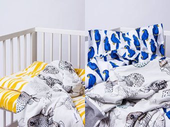 Bädda spjälsängen med bäddset från Mini Rodini